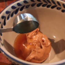 In another bowl, add your honey to the peanut butter.